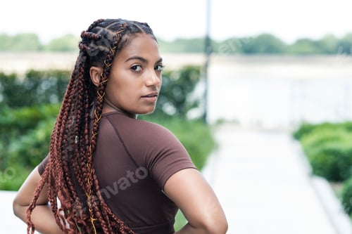 Preview: Natural portrait of young woman looking to camera.