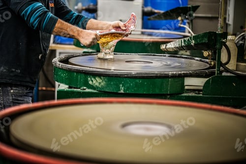 Preview: Man Working a Glass Blown Vase on Silica Sanding Disk