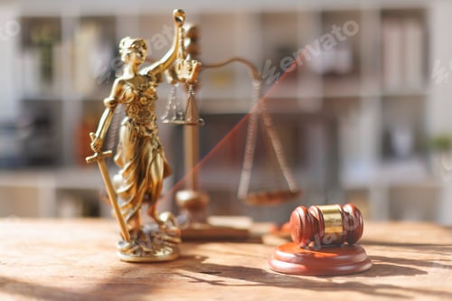 Preview: A wooden hammer, scales, legal documents and a laptop placed on the desk symbolize law, justice,