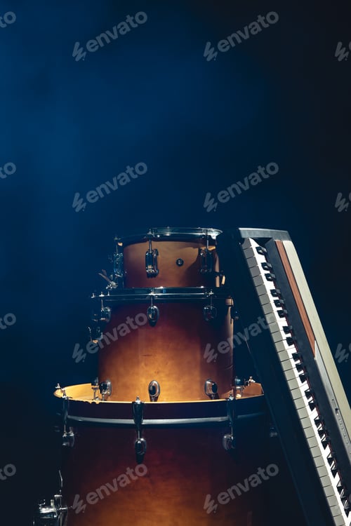 Preview: Drums and musical keys on a black background isolated.
