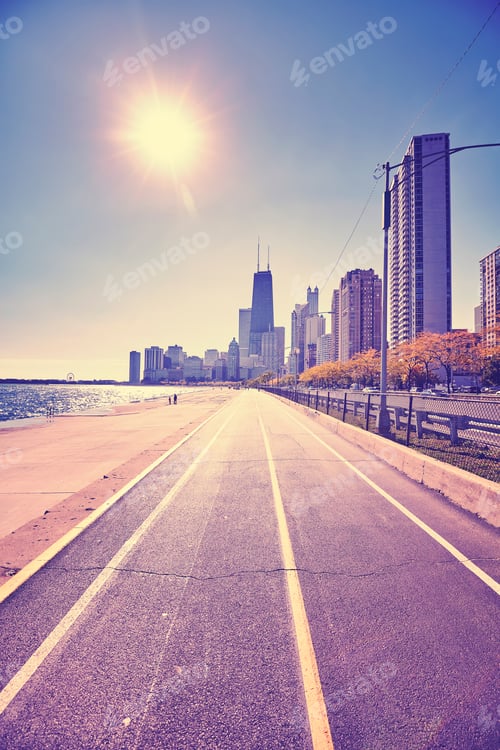 Preview: Retro stylized Chicago waterfront against sun with lens flare