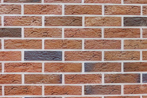 Preview: Background with a wide texture of decorative brick wall. Background for home or office design.