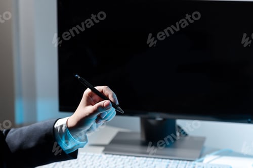 Preview: Businesswoman Holding Pen And Pointing On Important Message.