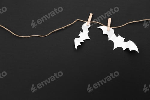 Preview: halloween and decoration concept - paper bats flying
