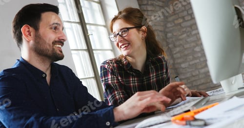 Preview: Portrait of young designers working on computer