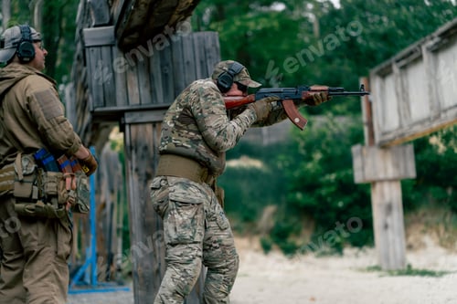 Preview: military tactical strategy rifle position for training on a professional shooting range trainer in