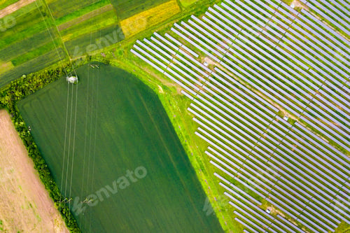 Preview: Aerial view of solar power plant on green field