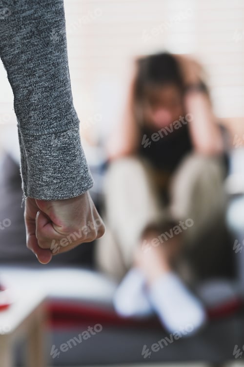 Preview: Aggressive man with clenched fist threatens to hit a scared woman. Domestic Family violence concept.