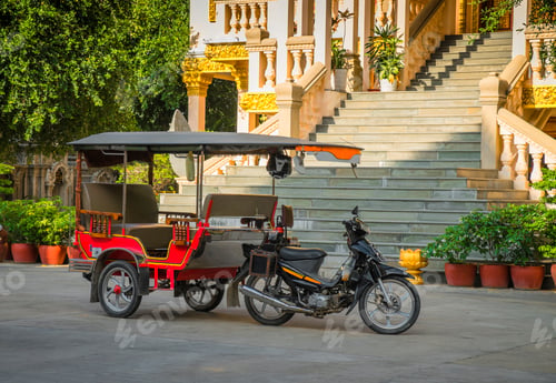 Preview: Tuk tuk taxi on street outside grand staircase to hotel or resort.