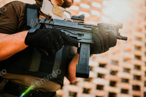 Preview: Soldier holding submachine gun in urban warfare scenario