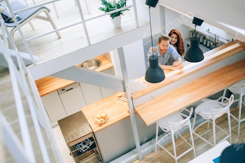 Aperçu: Beautiful couple in well designed kitchen