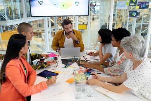 Preview: High angle view of diverse business people discussing in the meeting at conference room in office