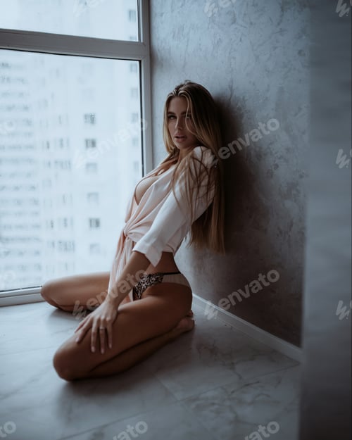 Preview: Blonde Woman Posing by Apartment Window