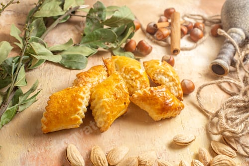 Preview: front view yummy nut pastries with fresh nuts on wooden desk cake sweet nut pastry
