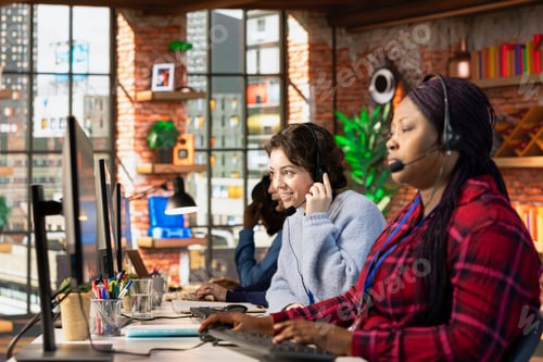 Preview: Portrait of customer service employee nest to coworker tracking support ticket