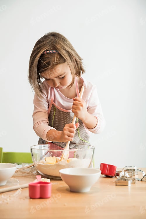 Preview: Girl mixing batter in bowl