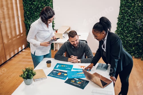 Preview: Multicultural team working together in office and having a meeting