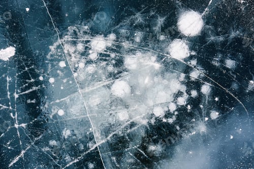 Preview: Natural ice bubbles on frozen lake in wintertime