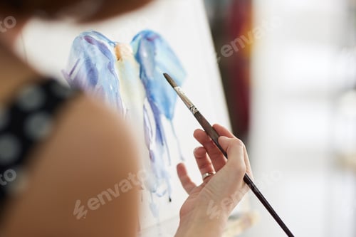 Preview: Process of painting picture at the easels in the art studio