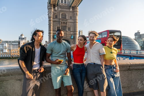 Preview: Multiracial group of happy young friends bonding in London