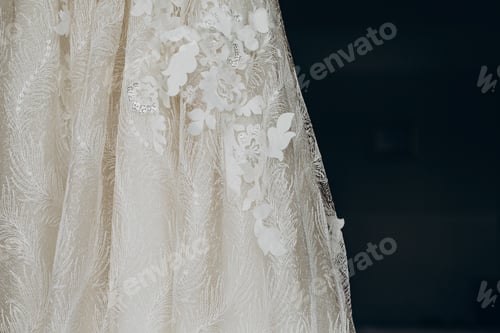 Preview: luxury wedding dress hanging on window in a hotel room