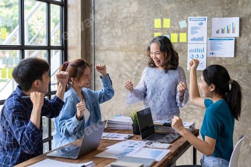 Preview: Group of young Asian businessmen raising their hands congratulating the success of the project. Pass