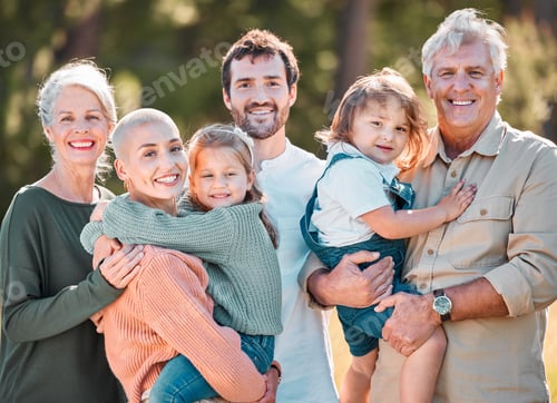 Preview: This is all of us. Shot of a multi-generational family posing together outdoors.