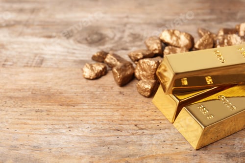 Preview: Gold nuggets and ingots on wooden background. Space for text