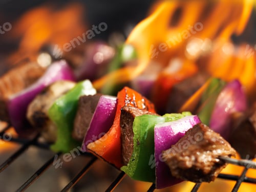 Preview: steak shish kabobs on grill with flames