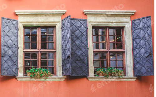 Preview: Old windows on the background of an orange wall in the old courtyard of the city.
