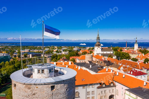 Preview: Flag of Estonia on the Tall Hermann Tower under the sunlight and a blue sky in Tallinn