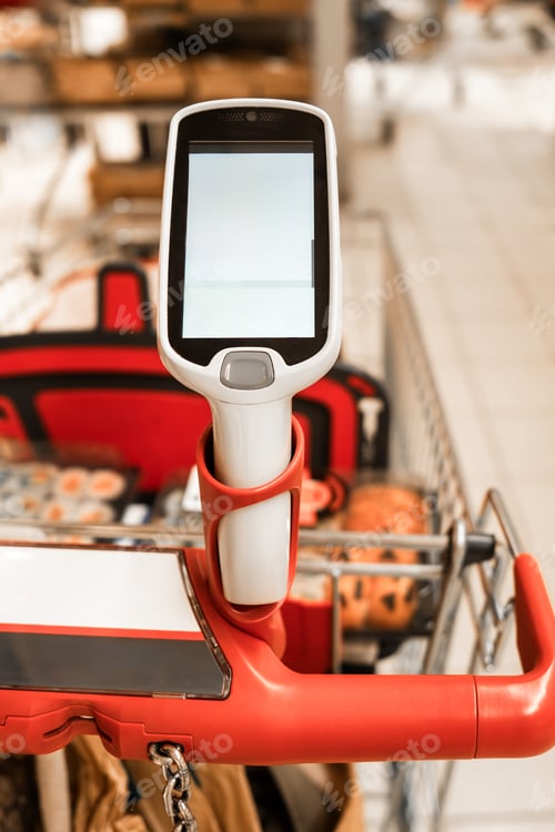 Preview: A hand-held scanner on a shopping cart in a supermarket