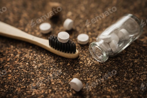 Preview: Bamboo Toothbrush and Toothpaste Tablets on Cork Surface