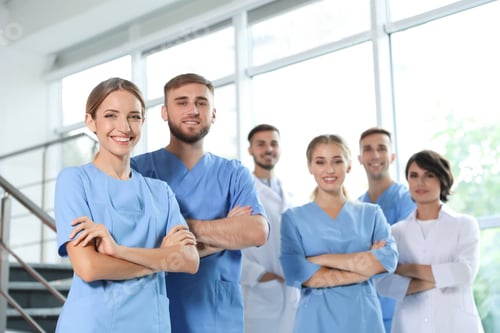 Preview: Team of doctors in uniform at workplace