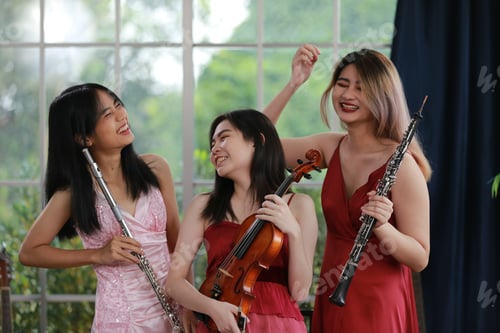 Preview: Women musical band playing instruments in background. Online home studio plays and sing a song.