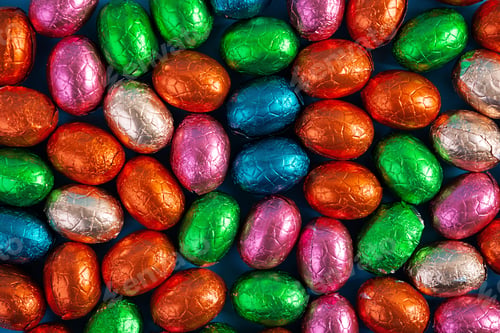 Preview: Colorful background of Easter chocolate eggs. Delicious chocolate eggs. Top view