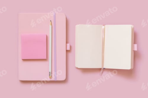 Preview: Pink notebooks, pencil and paper on light pink top view