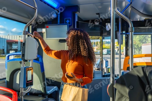 Preview: Young woman validating ticket on a bus