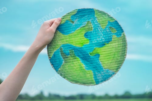 Preview: girl holding drawn planet in hands