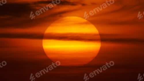 Preview: Big red Sun and clouds on the sunset.