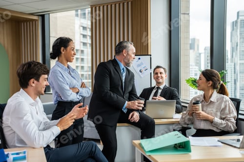 Preview: Group of multi-ethnic businessman and businesswoman working in office.