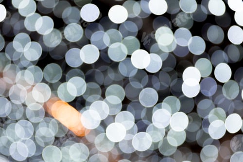 Preview: Abstract light bokeh as background defocused and blurred many round light on black background