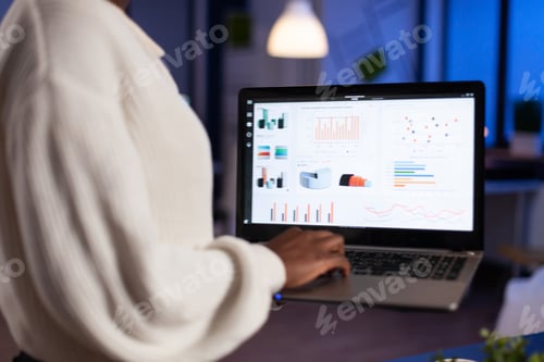 Preview: African american businesswoman holding laptop computer typing economic company profit