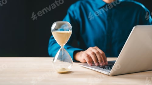 Preview: Hourglass showing time passing, sand glass clock concept highlighting business urgency for project