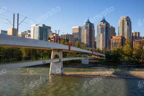 Preview: Bridge across Bow River during a vibrant summer sunrise