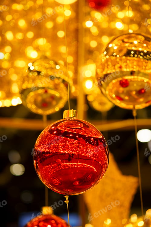 Preview: Abstract Christmas background with shiny golden balls on bokeh background
