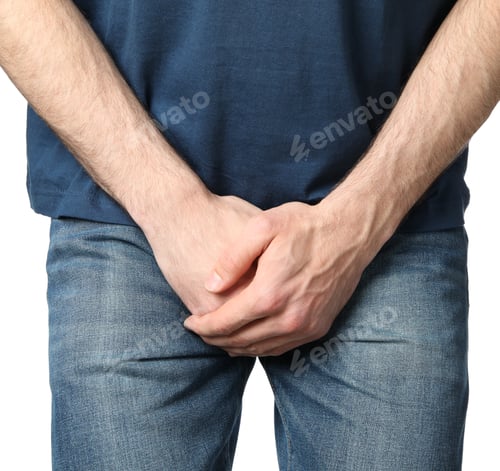 Preview: Man holds his crotch, isolated on white background