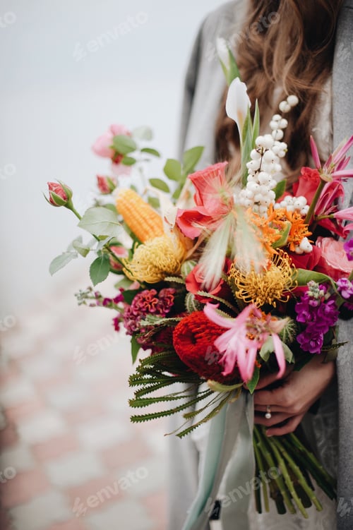 Romantic Bridal Bouquet Held by Woman in Coat