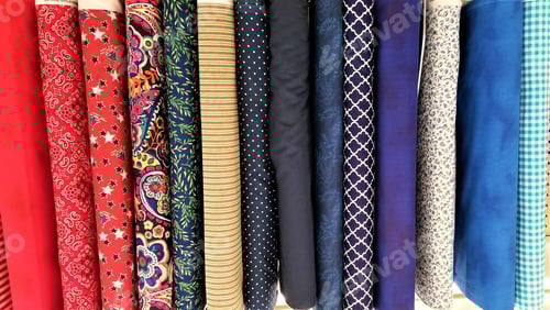 Preview: Colorful Variety of Rolled Fabric with Patterns