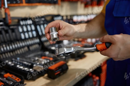 Preview: Worker is diligently working on a wrench inside a store